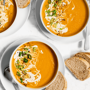 Butternut squash soup with slices of bread. 