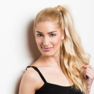 Young woman with a blonde ponytail. 