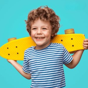 Boy with curly hair, and skateboard