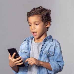 Boy with curly hair and cell phone