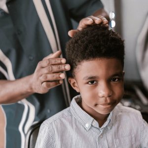 Boy with curly hair - short sides, long top