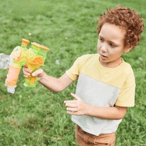 Boy with curly hair, and bubble machine