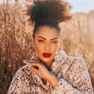 Girl with coily ponytail, updo. Fun hairstyle for curly haired girls. 